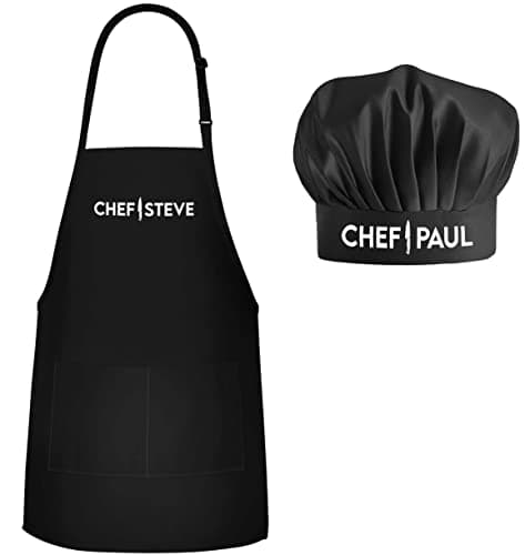 Personalized kitchen apron with professional knife-print design and custom name printed on front, shown with matching white chef hat on white background