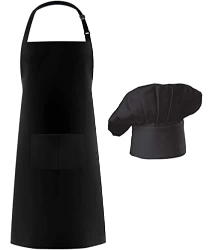 Black adjustable full-length adult kitchen apron with single front pocket, paired with white butcher-style chef hat on white background