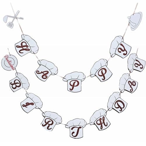Happy Birthday garland banner with chef hat-shaped letter pendants and kitchen tool accents in cooking theme