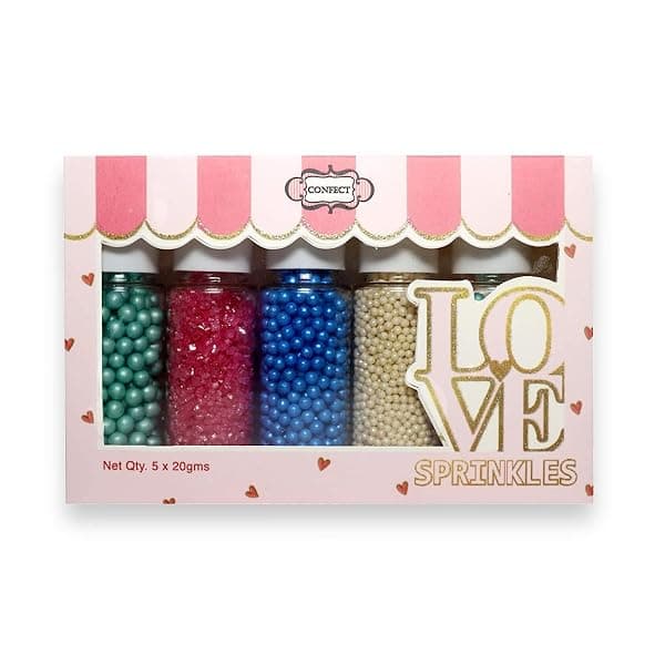 Assorted sprinkle topping station set in separate jars for cupcake decorating