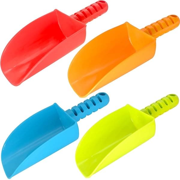 Set of child-size plastic sand shovels and digging tools in yellow
