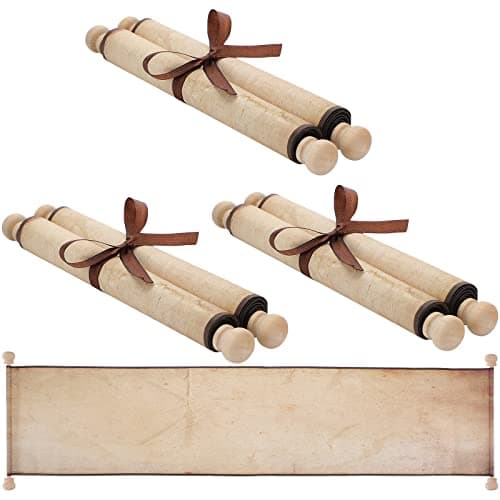 Three blank paper scrolls with wood rod ends, partially unrolled to show blank writing surface