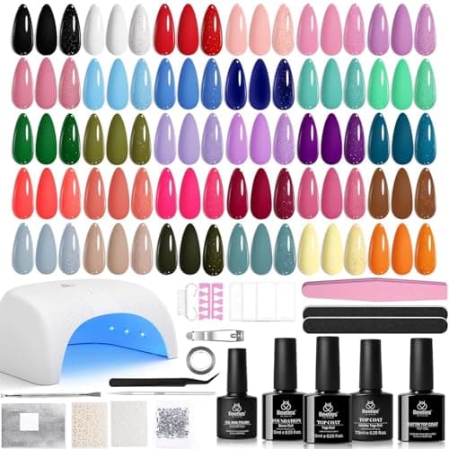 Beetles gel nail polish kit with 32 color bottles, UV LED curing lamp, base and top coats, and nail prep tools on white background
