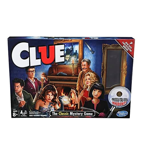 Hasbro Clue board game box with classic mystery game artwork, showing the game board, suspect cards, weapon tokens, and die arranged beside it