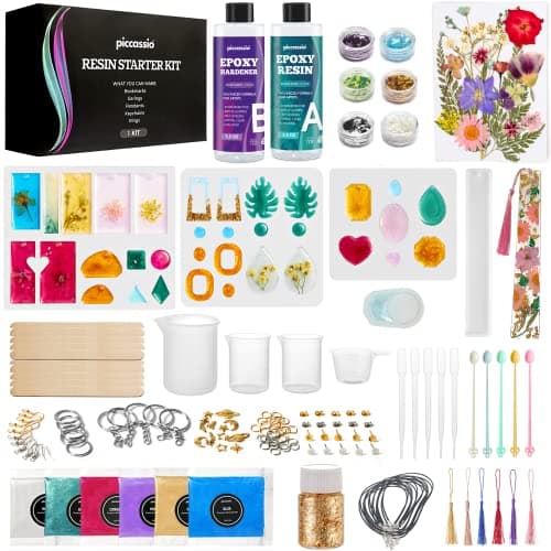 Piccassio resin jewelry making kit with silicone keychain and bookmark molds, dried flowers, glitter, and crafting tools on white background