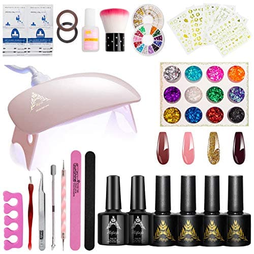 39-piece nail art starter kit with LED curing lamp, four gel polish bottles, base coat, top coat, rhinestone gems, and nail art sticker sheets